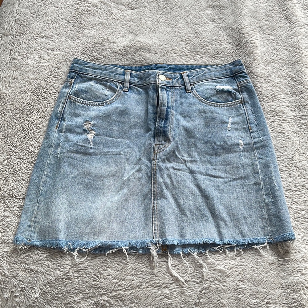 Denim de-stressed mini skirt